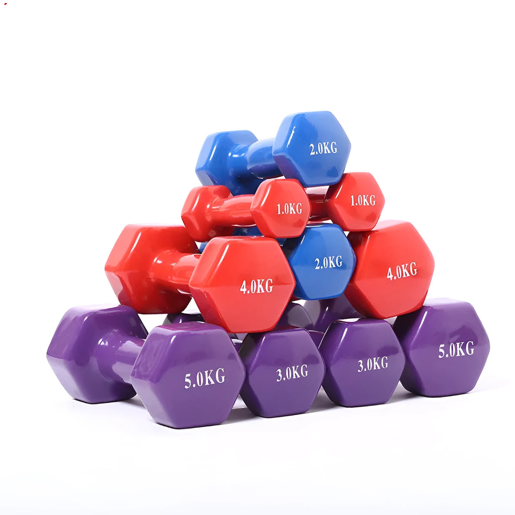 Brightly coloured plastic-coated fitness dumbbells in various weights on a floor.