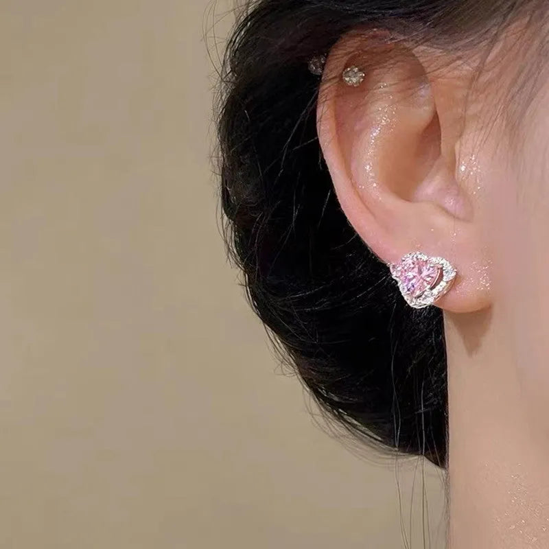 White k gold electroplated heart shaped stud earrings on copper material