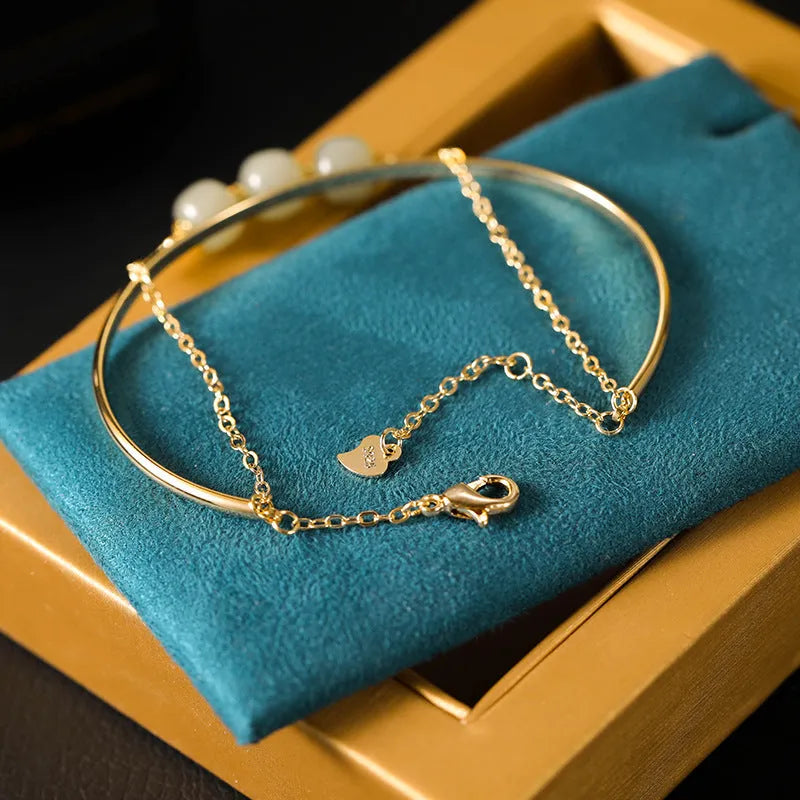 Jade lucky beads bracelet for women with gold inlay detailing showing single, double and three beads versions
