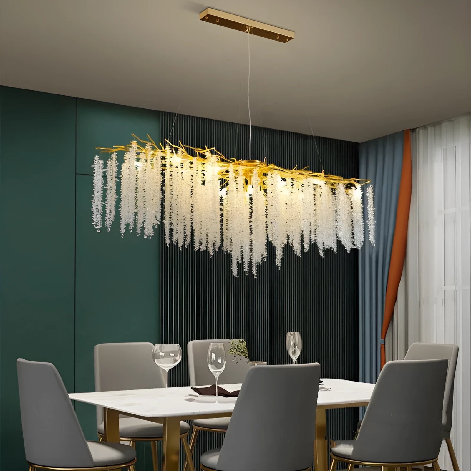 Modern crystal chandelier light with adjustable chain above a dining table.