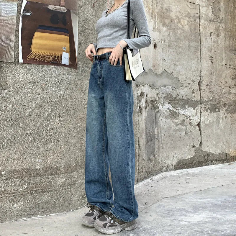 Women's high-waist retro blue straight-leg jeans on a model, showing the classic fit.