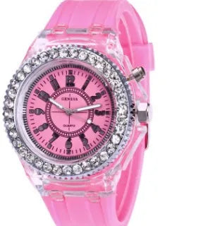 Women's LED luminous watch with round alloy case and colourful silicone strap.