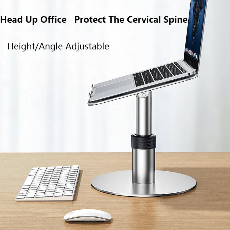 Silver adjustable aluminium laptop stand raised to mid-height with ventilation holes visible.