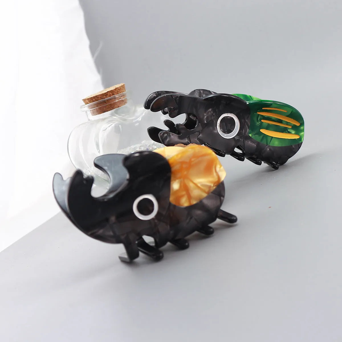 Handmade cellulose acetate insect brooch with beetle grip pin in green, orange, or white caterpillar designs