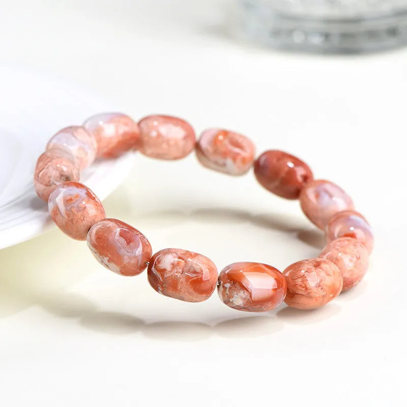 Agate barrel bead bracelet with cherry blossom colour and a ruyi element
