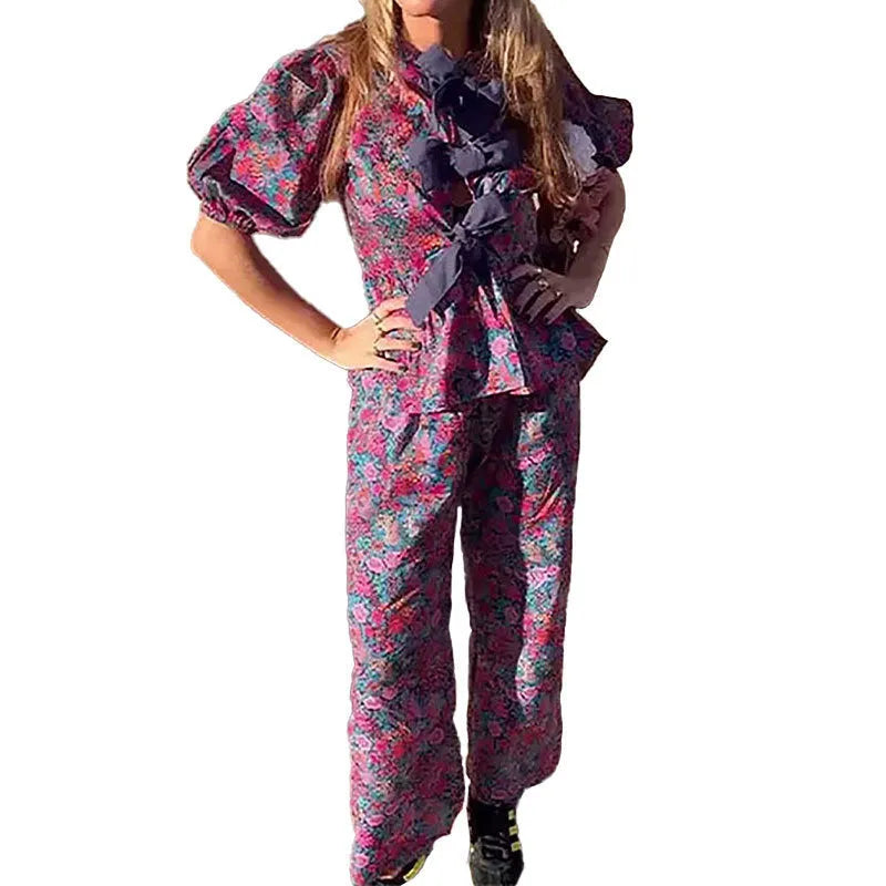 Leisure floral printed tie-neck trousers suit with puff sleeves, shown in picture colour.