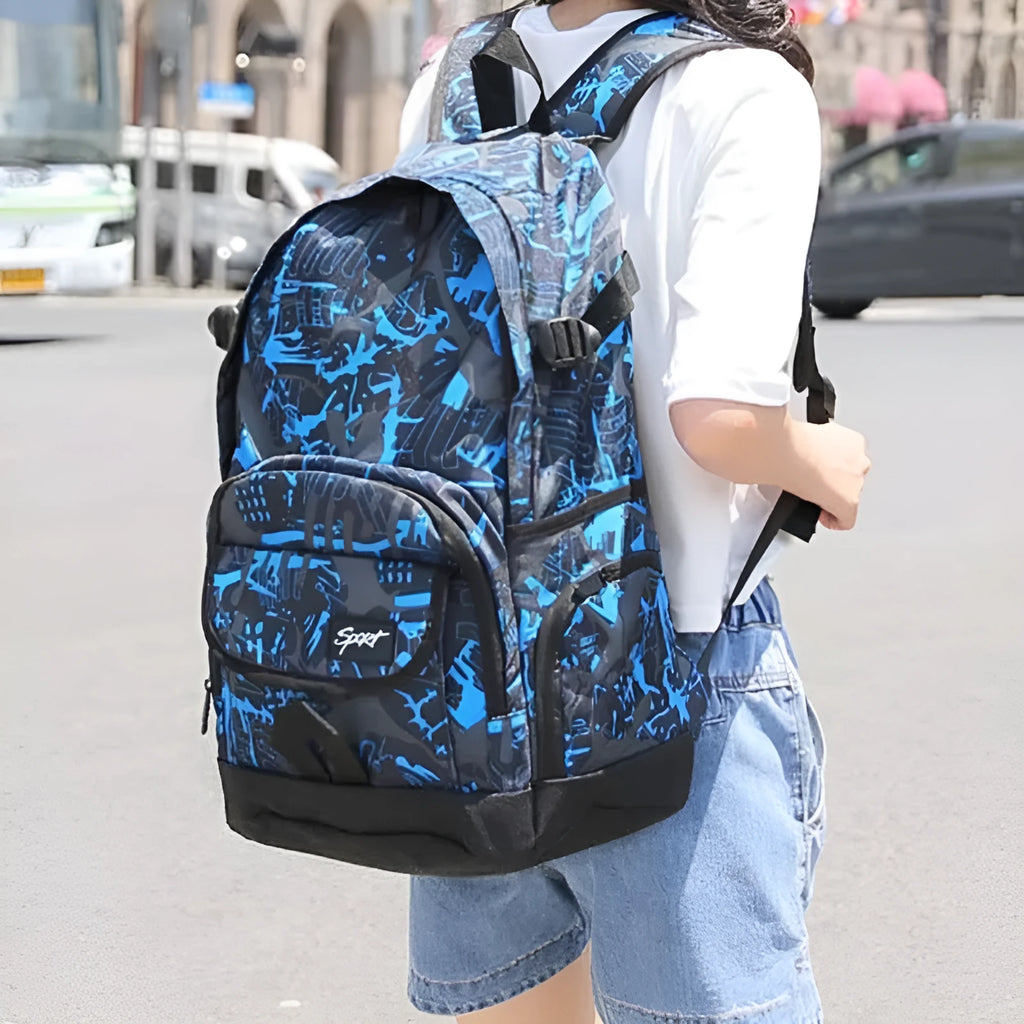 Blue and red classic nylon backpack with large main compartment for school, travel, and outdoor use