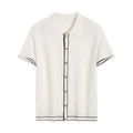White short sleeve women's cardigan with dark contrasting lapels laid flat.