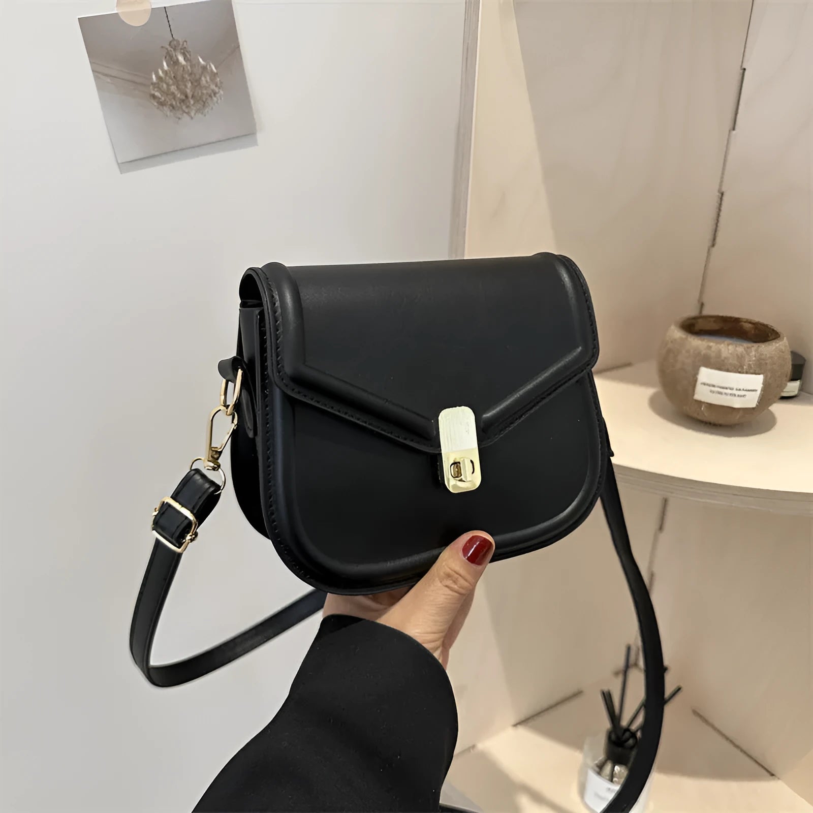 Soft, textured PU clamshell messenger bag in a horizontal rectangle shape.