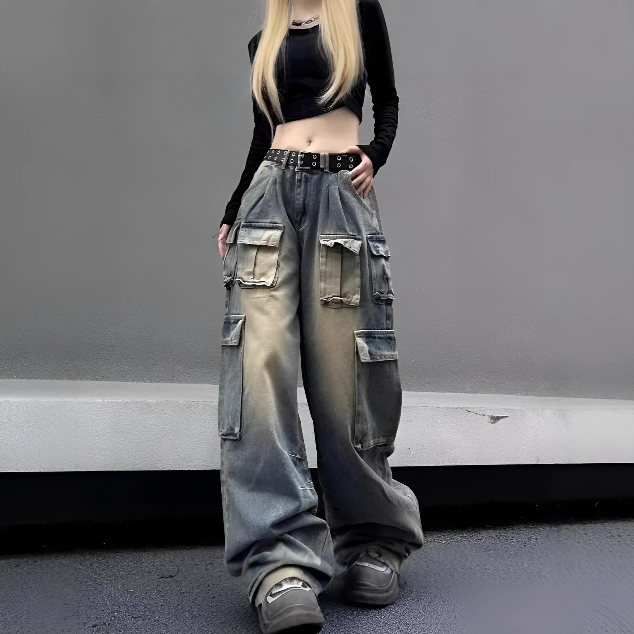 Light blue and black loose fit distressed denim pants with multiple tooling-style pockets