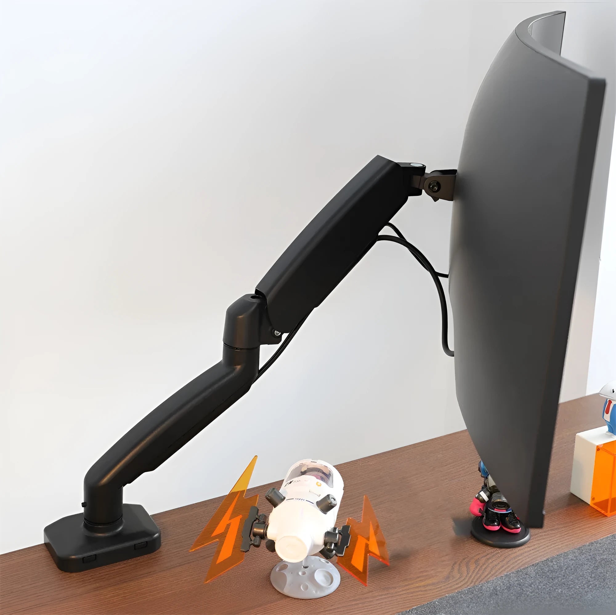 Black rotating telescopic LCD screen bracket elevating a monitor on a desk.