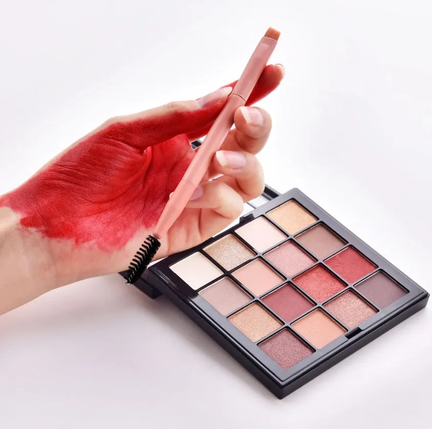 Ten professional makeup brushes with wooden handles in a pink box, including powder, foundation, and double-ended brushes.