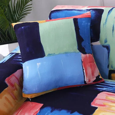 Geometric print stretch sofa slipcover fitted on a grey three-seater sofa.