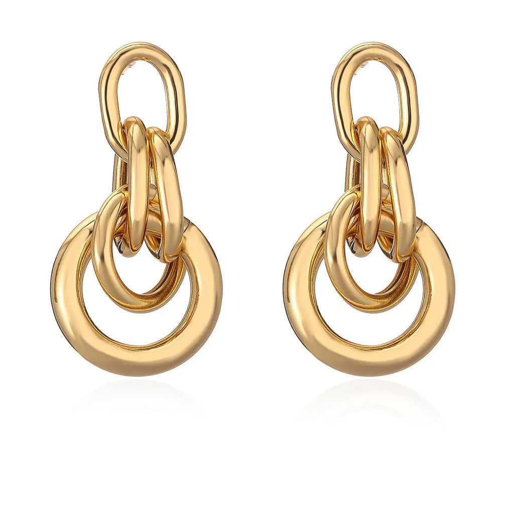 Geometric copper earrings for women in gold with irregular high-profile shape