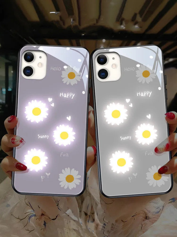 Luminous phone case for iPhone with voice-activated colour light showing painted daisy design on white TPU material