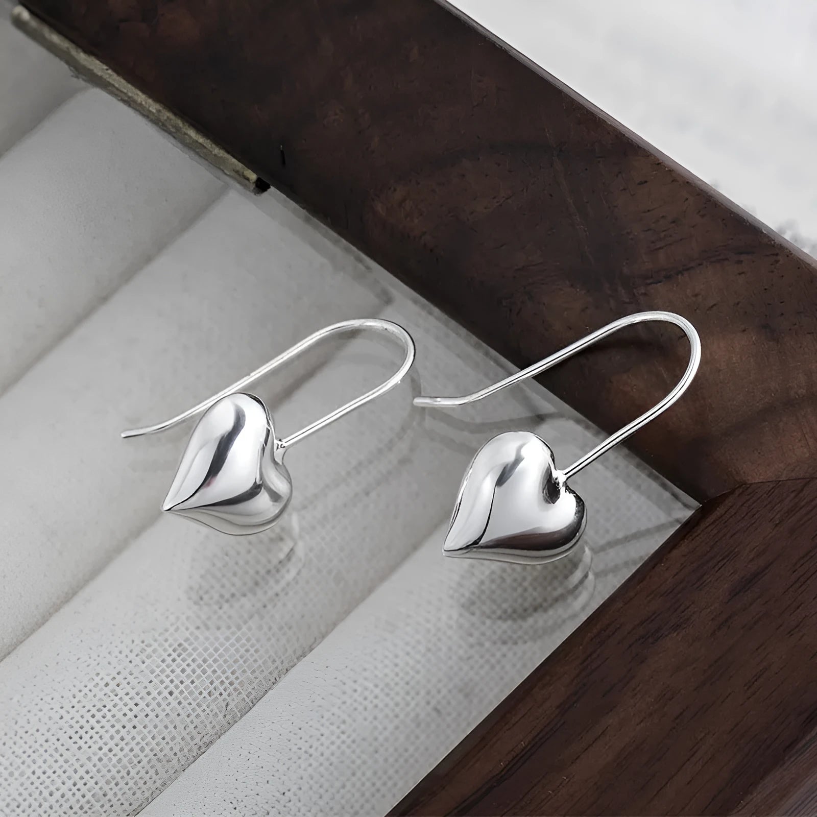 Korean-style copper heart earrings with 3D glossy finish and silver heart-shaped ear hooks