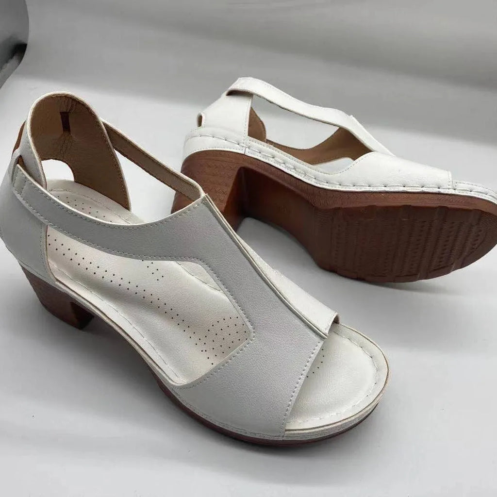 Roman style women's wedge sandals with open peep toe, buckle detail, and a low heel, shown in multiple colours.