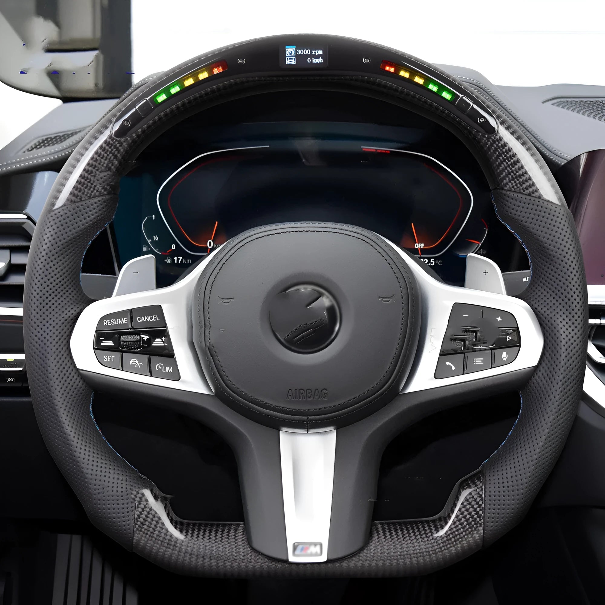 Black carbon fibre sports steering wheel with LED display for BMW X3 and X5 cars.