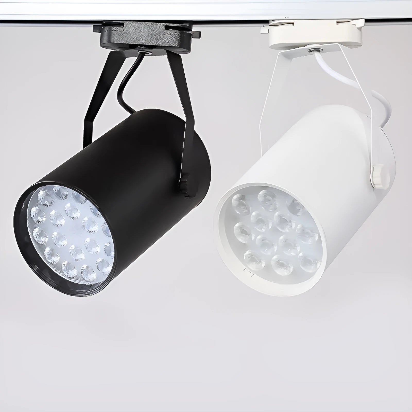 LED track spotlight with a slide mount in a choice of black or white aluminium shell.
