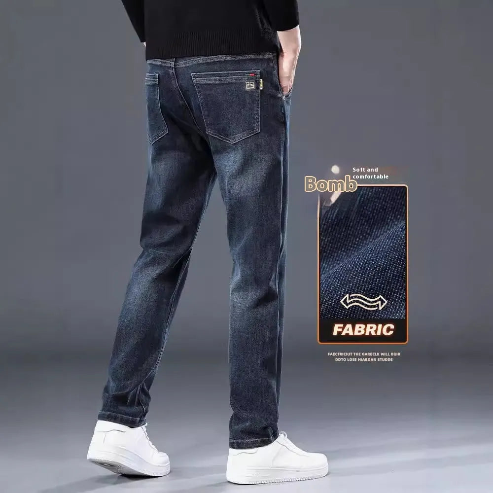 Man wearing blue grey slim straight casual trousers with a loose fit and zip fly for summer street fashion