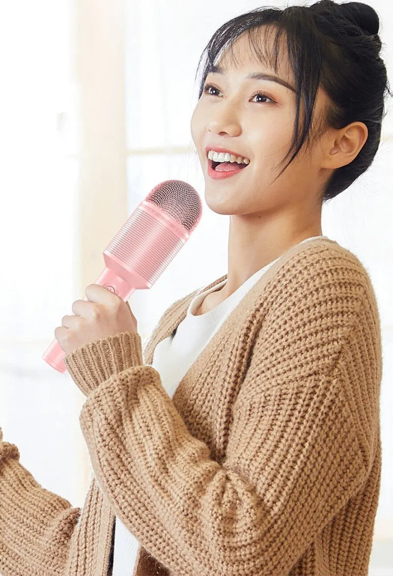 USB Bluetooth karaoke microphone in blue, green, or pink colours with integrated audio system