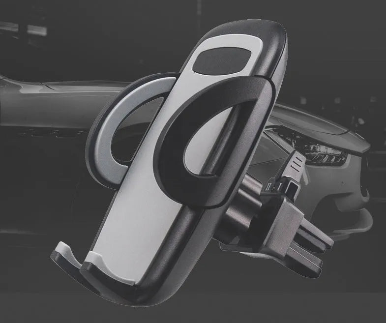 Black plastic mobile phone holder mounted on car air conditioning vent
