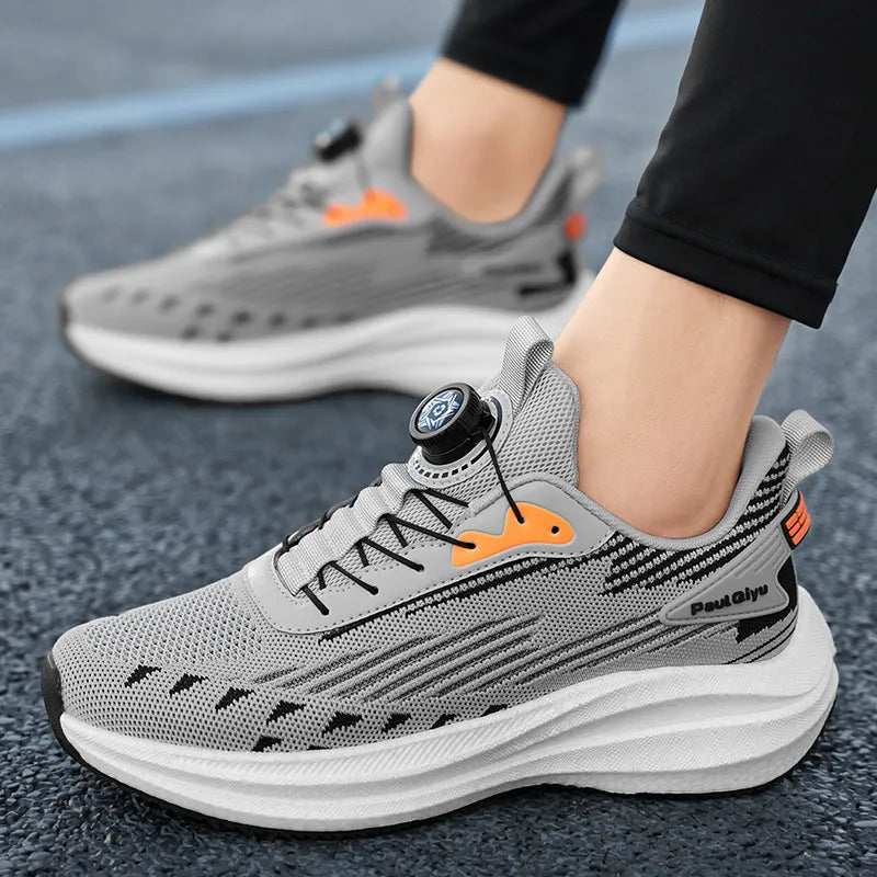 Men's white green and gray running shoes with rotating buckle and mesh upper on flat TPU sole.
