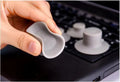 Set of four grey plastic laptop cooling pads, two large and two small, on a flat surface.