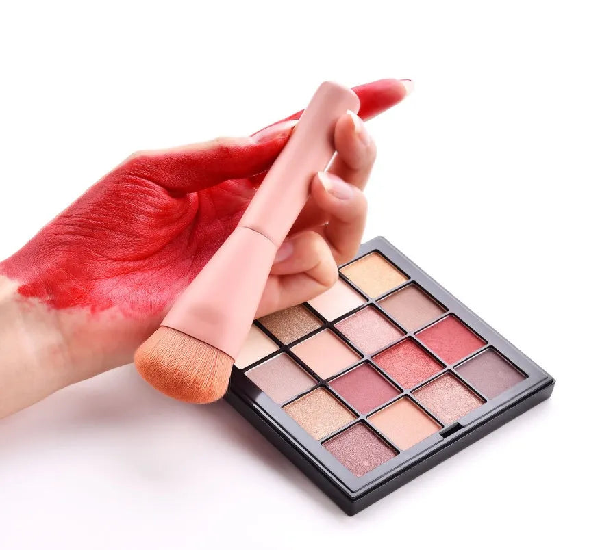 Ten professional makeup brushes with wooden handles in a pink box, including powder, foundation, and double-ended brushes.