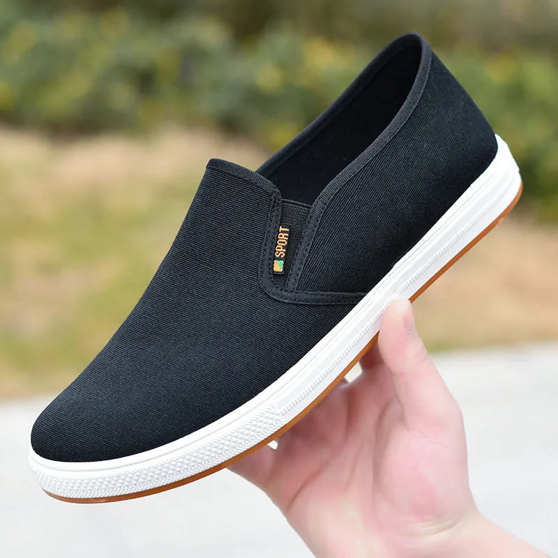 Men's black and blue canvas slip-on shoes with round toe and low-top design
