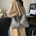Retro large capacity PU tote bag in black with double shoulder straps and sewing line detail