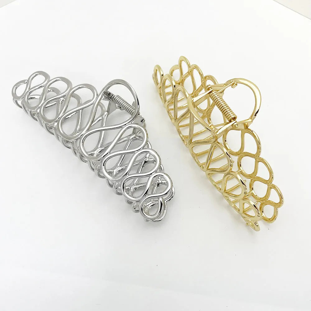 Large minimalist hair clip for updo hairstyles in gold electroplated alloy with tassel accents