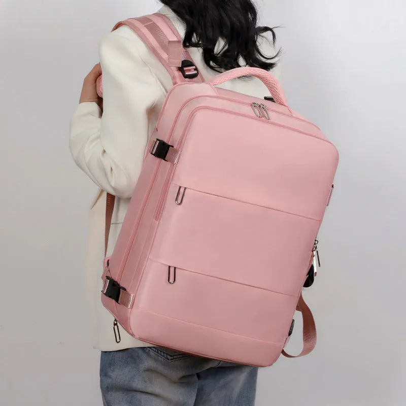 Large purple travel backpack with multiple compartments and air pillow shoulder straps
