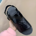 Men's black embroidered floral pattern beach sandals with flat heel showing size range