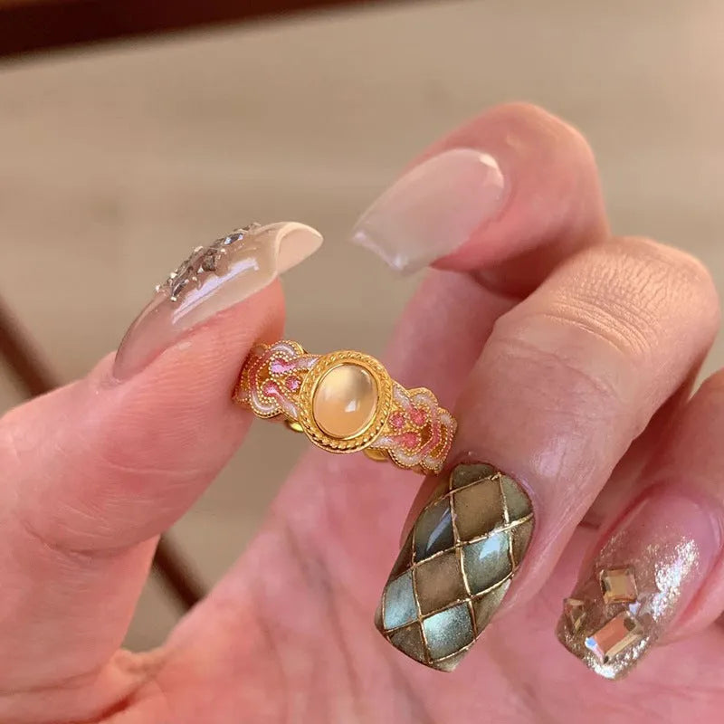 Pink crystal enamel geometric open ring on gold-plated copper band with adjustable cuff design