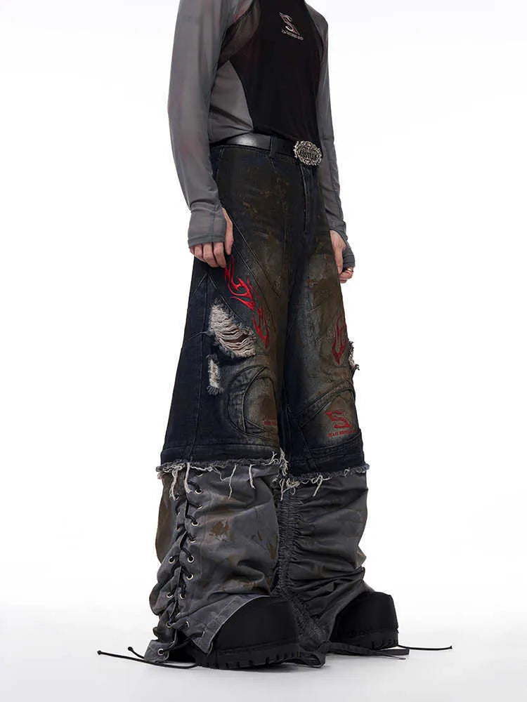 Men's retro-style denim jeans with detachable legs in a wide-leg, loose fit.