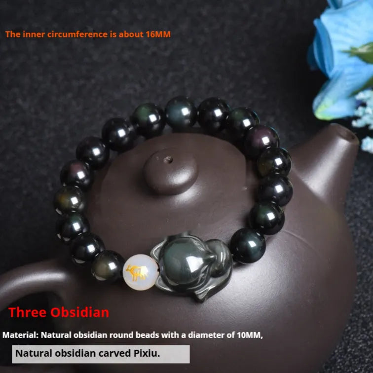 10mm obsidian zodiac bracelet on wrist showing adjustable cord closure and polished stone beads