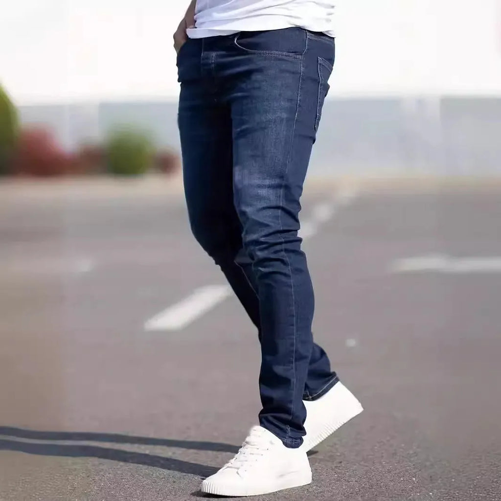 Men's dark blue slim fit casual jeans with skinny leg cut and zipper fly closure