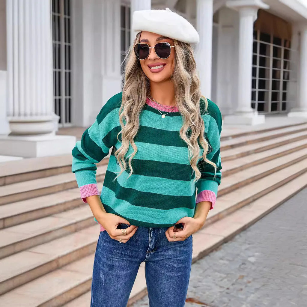 Women's loose fit long sleeve round neck sweater in a striped pattern, shown in a blue colour option.