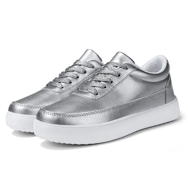 Women's white leather lace-up casual flat shoes on a plain background