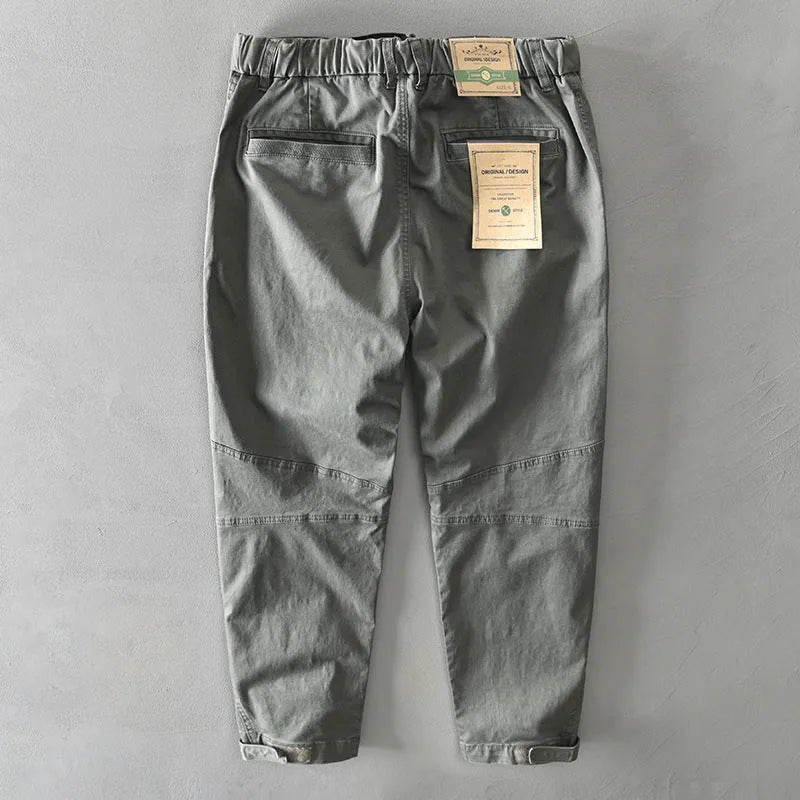 Men's casual cotton overalls in khaki with an elasticated waistband, shown in a loose fit.