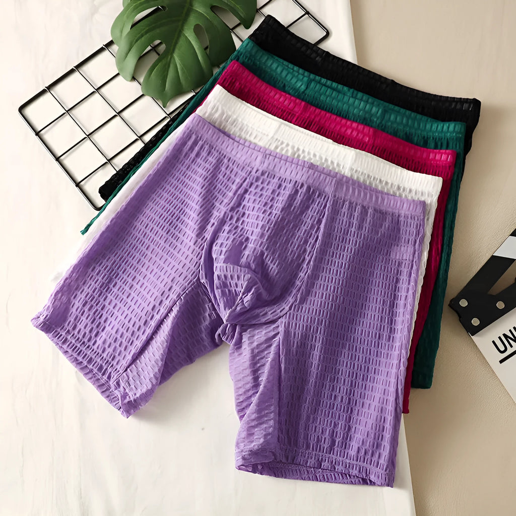 Men's lace fabric boxer shorts in light purple with a lengthened hip lifting shaping design.
