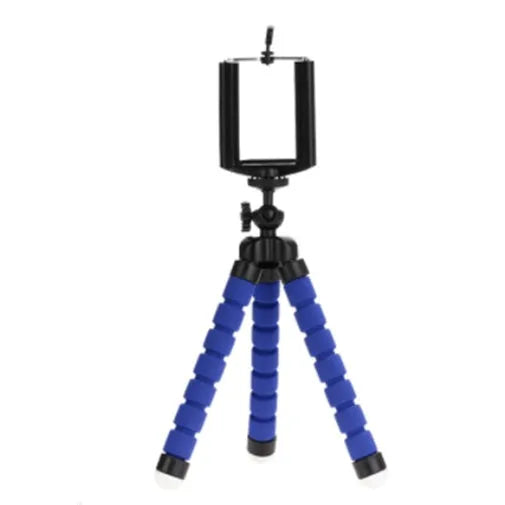 Black flexible octopus-style mini tripod with coiled legs next to a smartphone
