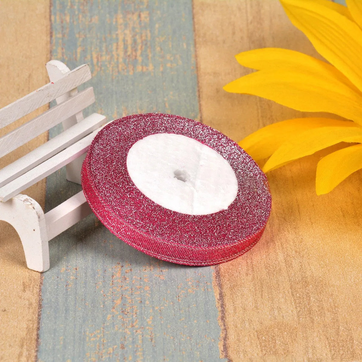 Green onion coloured polyester ribbon with gold polka dots on 25-yard spool for decorative trimming