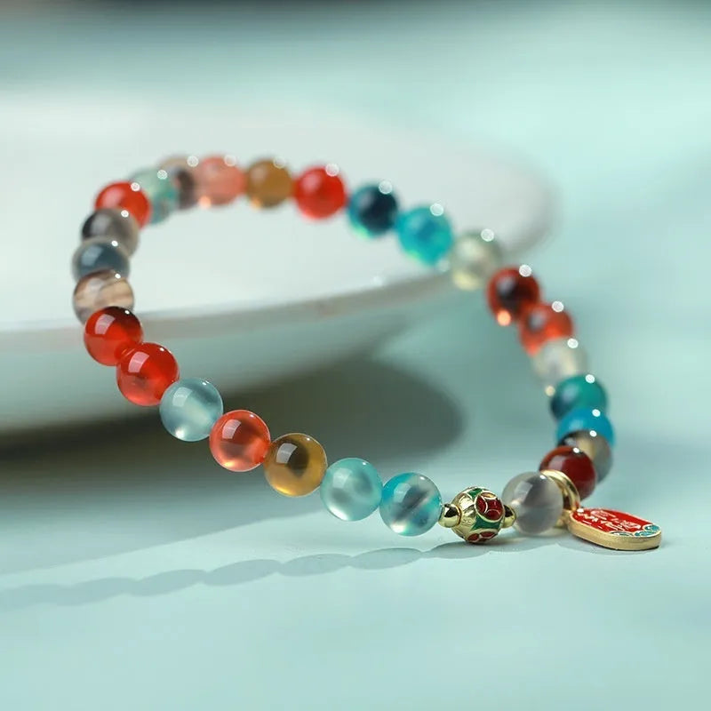 Women's agate bracelet with natural colourful sugar heart design and copper coin snake detailing