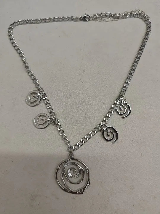 Spiral donut geometric jewellery set with necklace, bracelet, and ear hooks in gold or silver electroplated finish