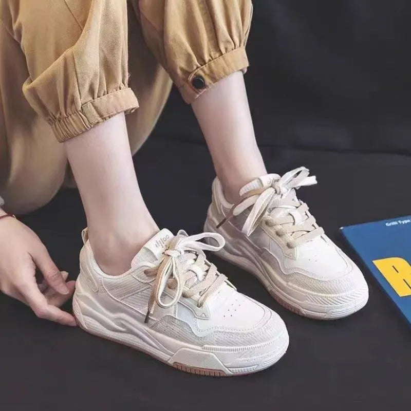 Low top rubber sneakers in pink and milky white with height-increasing design