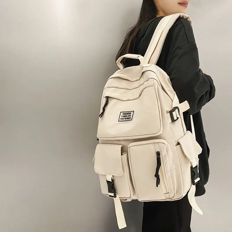 Black student backpack with three-dimensional pockets showing computer compartment