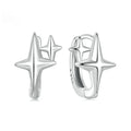 Minimalist star design silver ear clip with XINGX detail on a plain background.