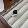 Adjustable sterling silver ring with black agate heart centrepiece